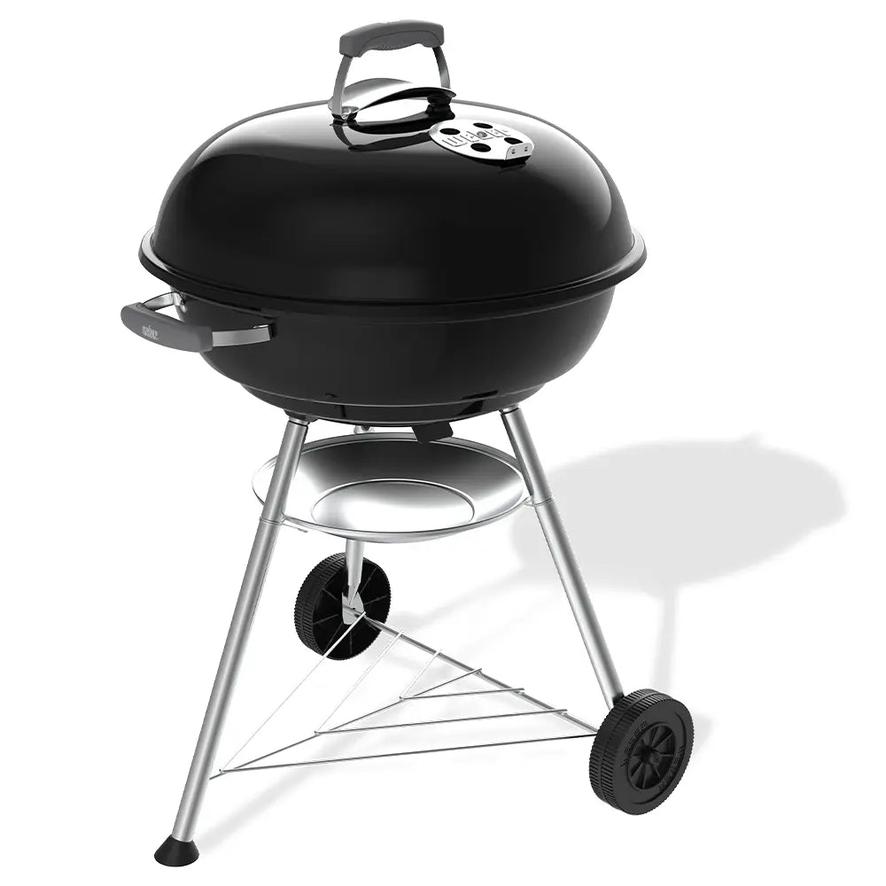 Barbecue à charbon Weber Compact Kettle 57 cm avec couvercle, cuisson homogène et ventilation réglable. Idéal pour grillades familiales jusqu’à 11 personnes avec cuisson directe et indirecte.